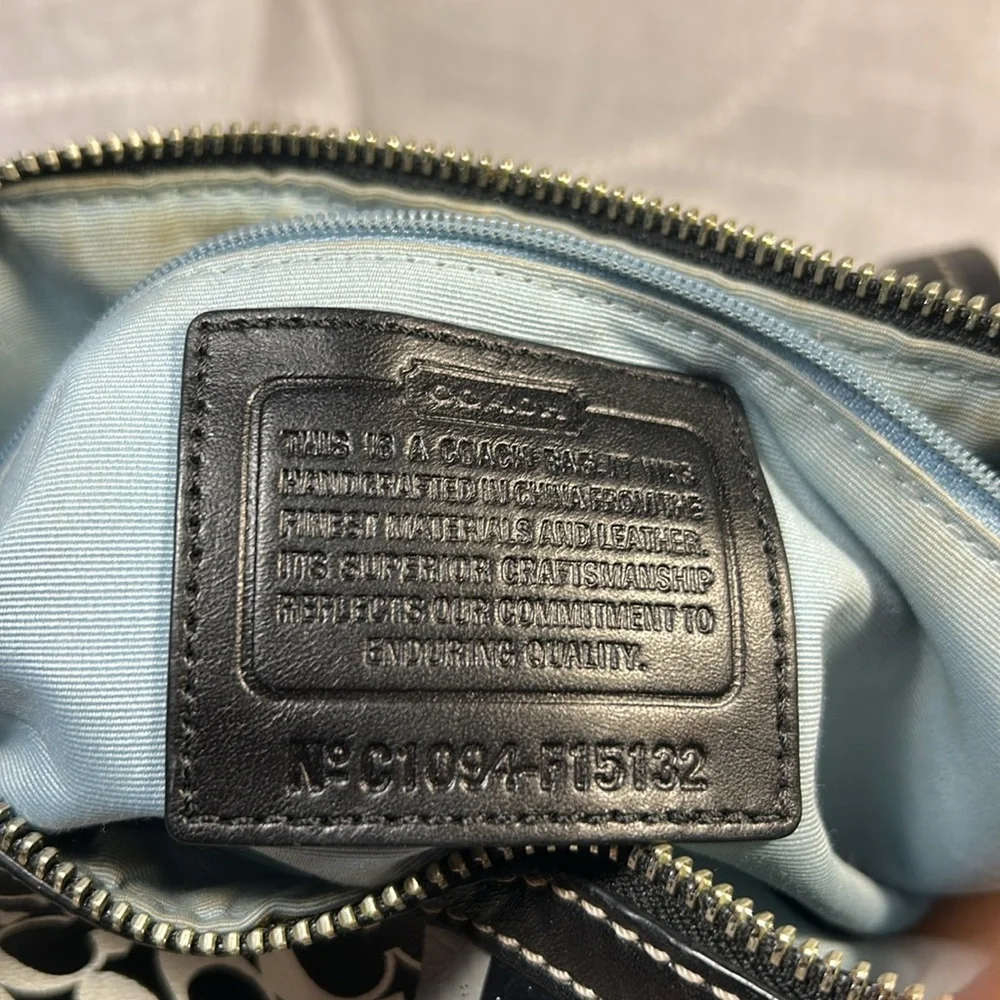 Coach boston leather travel bag with a tag